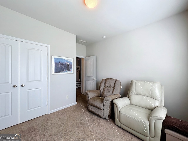 sitting room featuring carpet