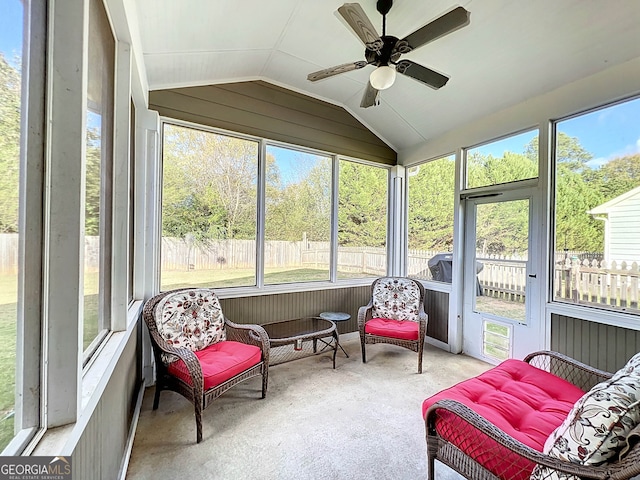 sunroom with ceiling fan and lofted ceiling