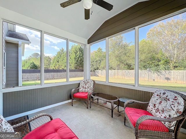 sunroom / solarium featuring plenty of natural light, ceiling fan, and vaulted ceiling