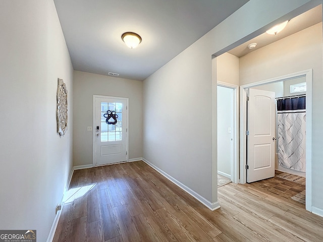 foyer entrance featuring light hardwood / wood-style flooring