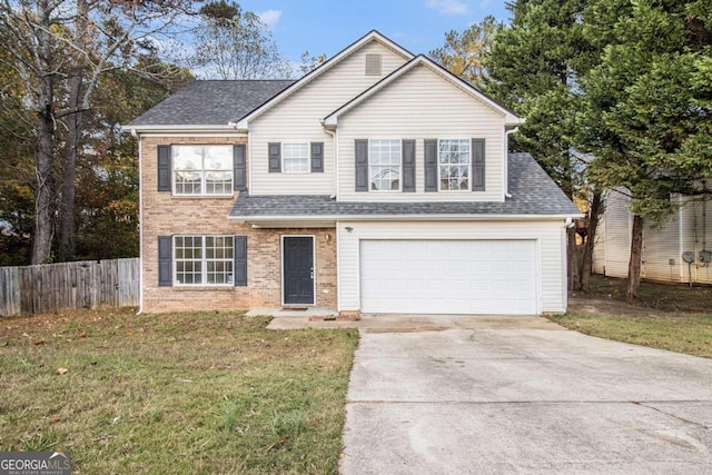 view of property with a front yard and a garage