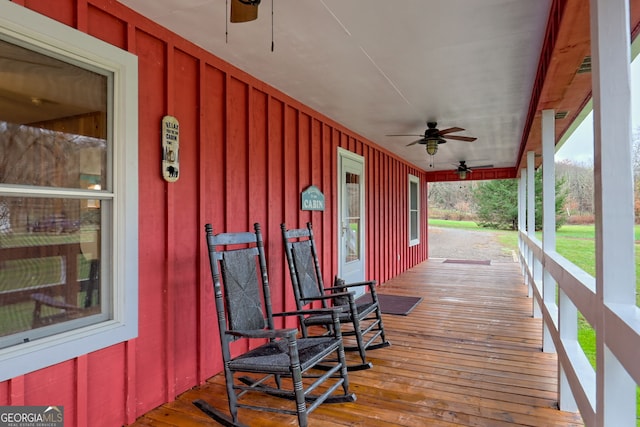 wooden deck with ceiling fan and covered porch