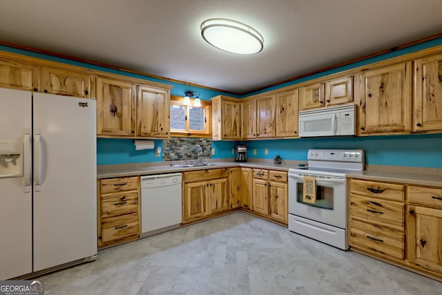 kitchen with sink and white appliances