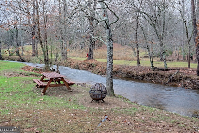 view of yard with an outdoor fire pit