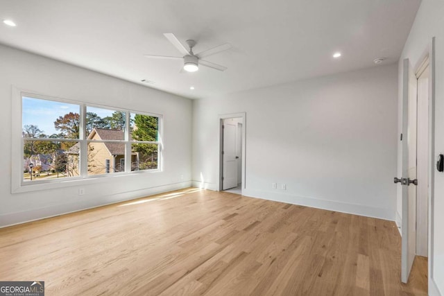 empty room featuring light hardwood / wood-style flooring and ceiling fan