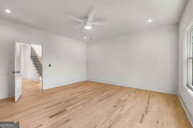 empty room featuring ceiling fan and light hardwood / wood-style floors