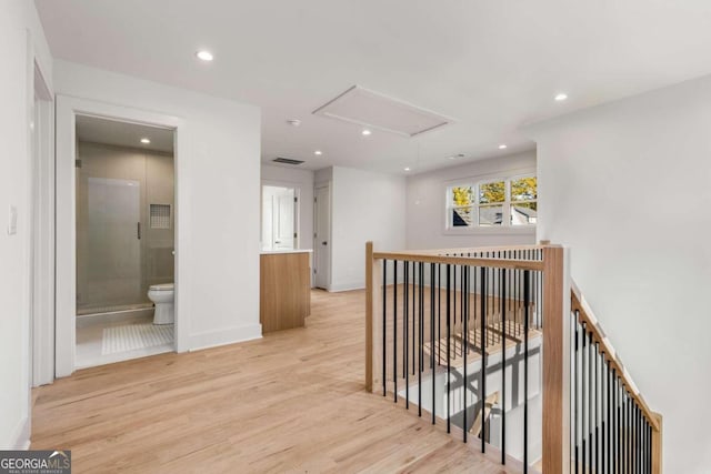 corridor featuring light hardwood / wood-style floors