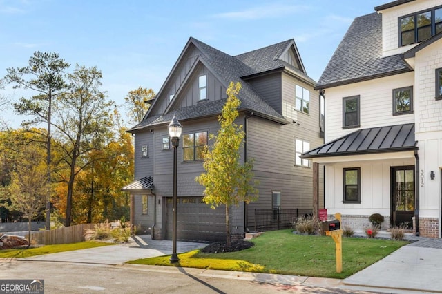 view of front of property featuring a front lawn and a garage