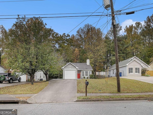 view of front of house with a garage and a front lawn