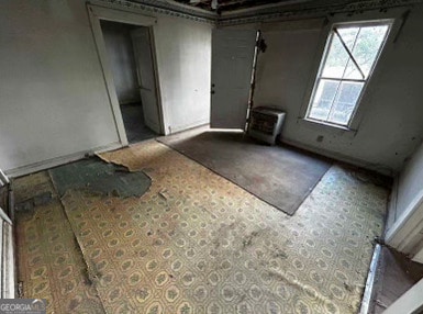 unfurnished room featuring carpet flooring