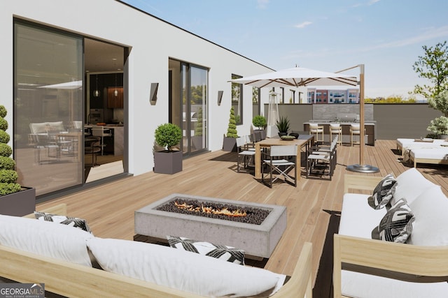 318 Sandy Springs Cir Unit 310, Atlanta, GA 30328 - wooden terrace featuring outdoor dining space and an outdoor living space with a fire pit