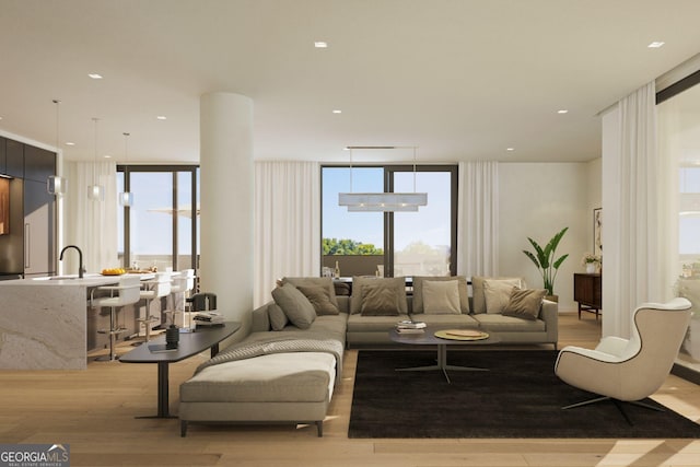 318 Sandy Springs Cir Unit 310, Atlanta, GA 30328 - living room featuring a wall of windows, light wood-style flooring, and healthy amount of natural light