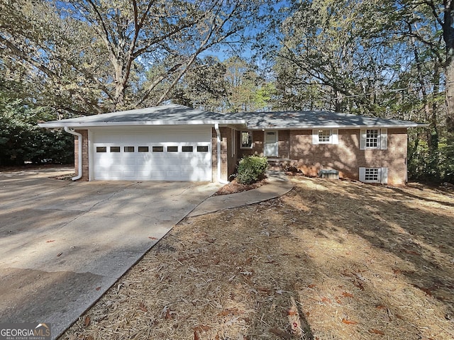 single story home featuring a garage