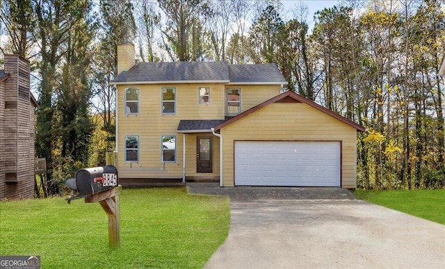 view of front facade featuring a garage and a front lawn