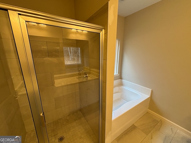 bathroom with shower with separate bathtub