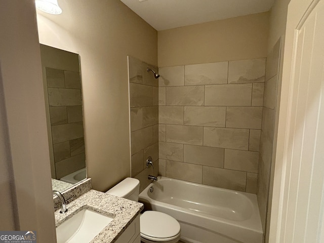 full bathroom with vanity, toilet, and tiled shower / bath