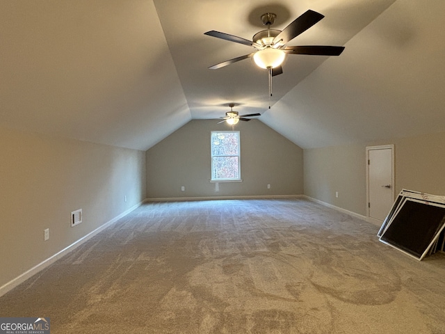 bonus room featuring carpet, vaulted ceiling, and ceiling fan