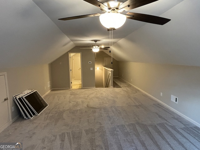 additional living space featuring ceiling fan, light colored carpet, and lofted ceiling