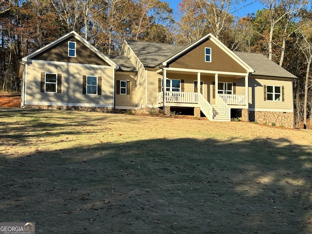 craftsman house featuring a front yard and a porch