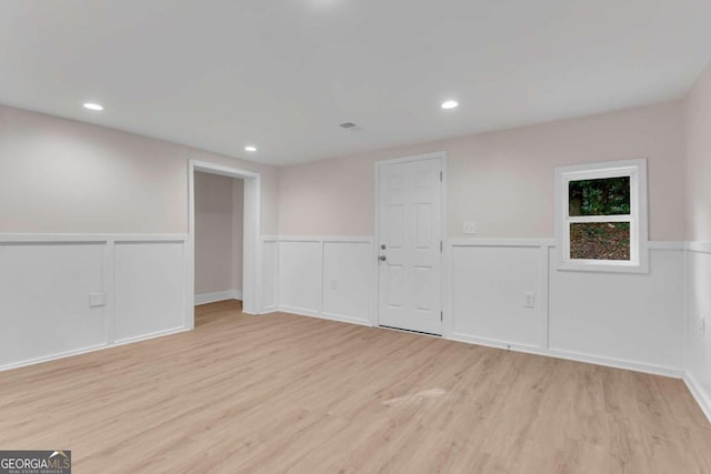 spare room with light wood-type flooring