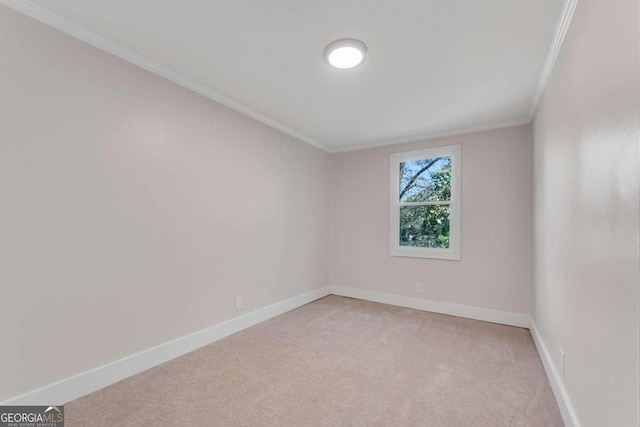 carpeted spare room with crown molding