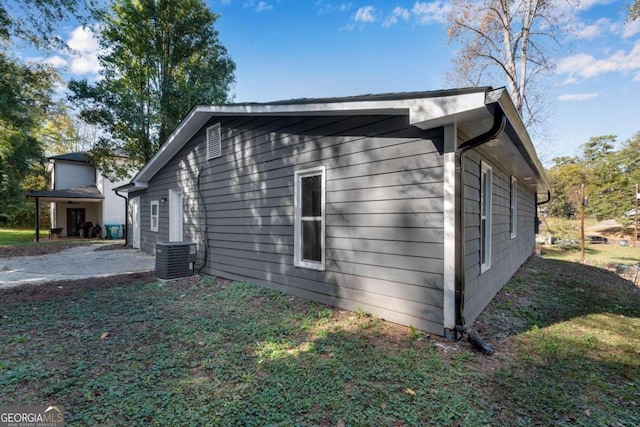 view of home's exterior featuring a patio and central AC