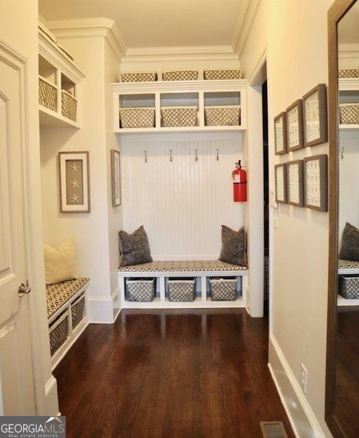 mudroom with hardwood / wood-style flooring and crown molding