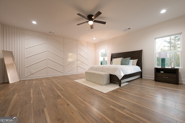 unfurnished bedroom featuring hardwood / wood-style floors and ceiling fan