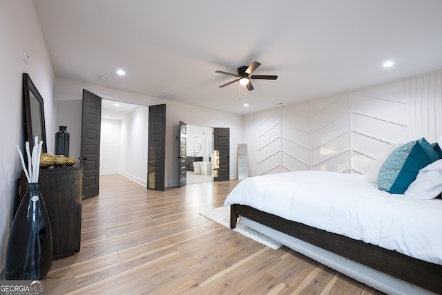 bedroom featuring ceiling fan and hardwood / wood-style flooring