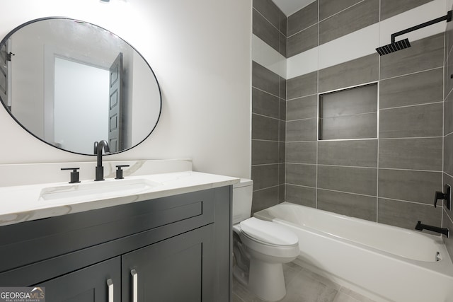 full bathroom with vanity, toilet, and tiled shower / bath