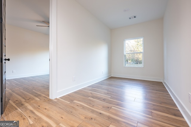 spare room featuring ceiling fan and hardwood / wood-style floors