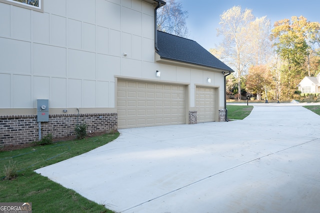 view of side of property featuring a garage