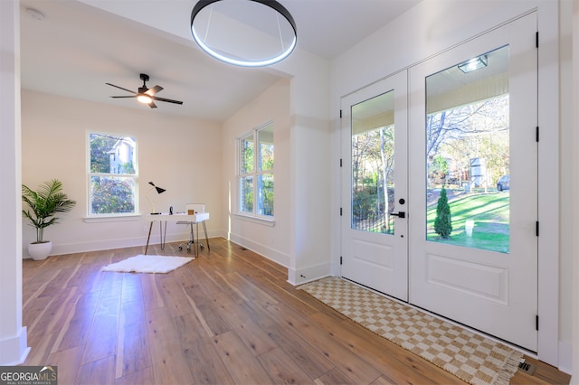 entryway with french doors, light hardwood / wood-style floors, and ceiling fan