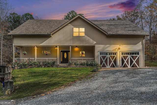 view of front facade featuring covered porch and a yard