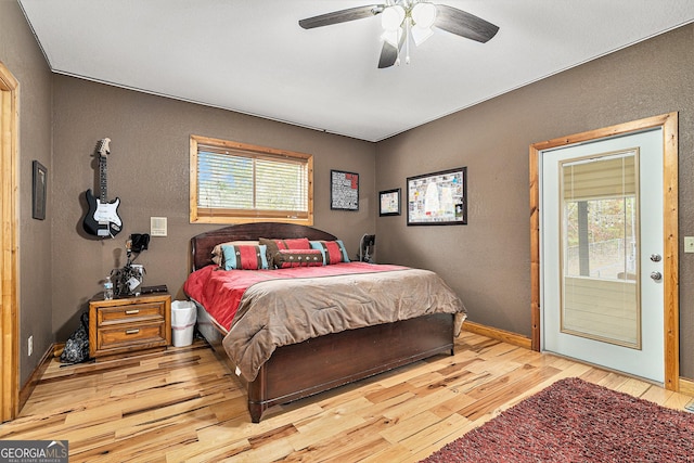 bedroom with ceiling fan and light hardwood / wood-style flooring