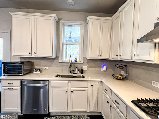 kitchen featuring white cabinetry and sink