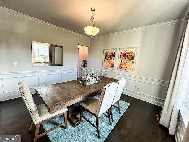 dining area featuring dark hardwood / wood-style floors and crown molding