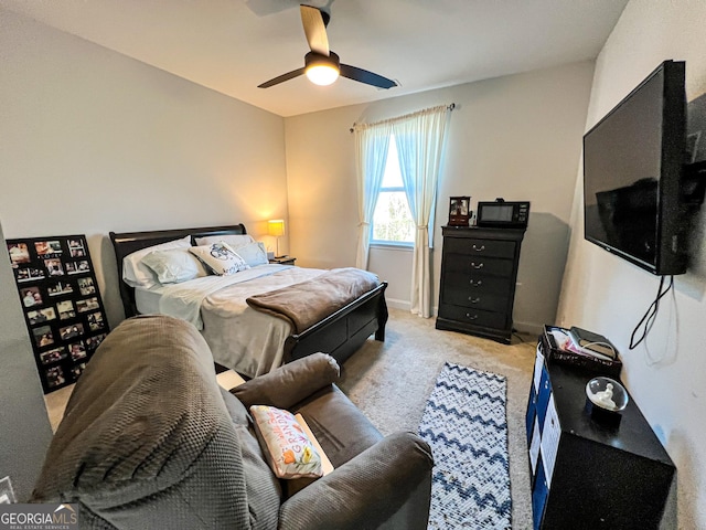 bedroom with light colored carpet and ceiling fan