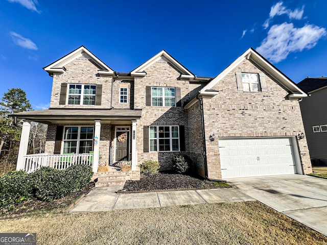 view of front of home with a porch and a garage