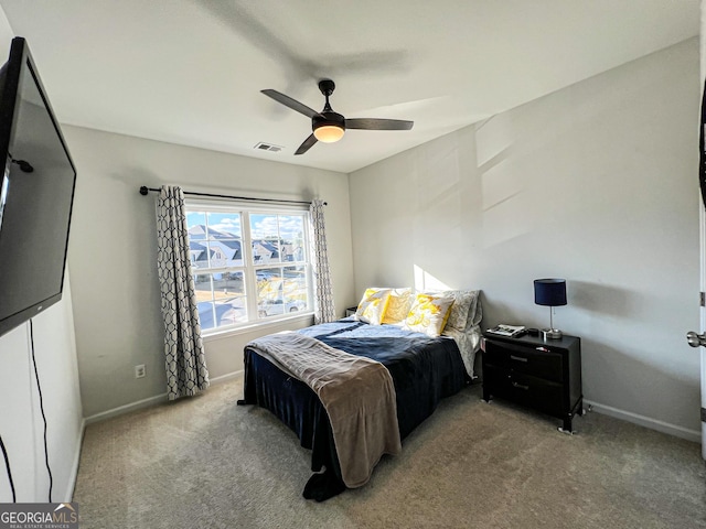 carpeted bedroom featuring ceiling fan