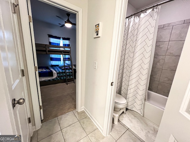 bathroom with tile patterned flooring, ceiling fan, toilet, and shower / bath combo with shower curtain