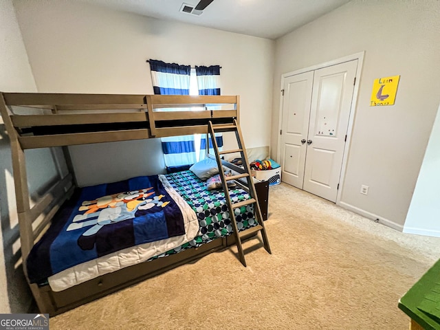 carpeted bedroom with a closet