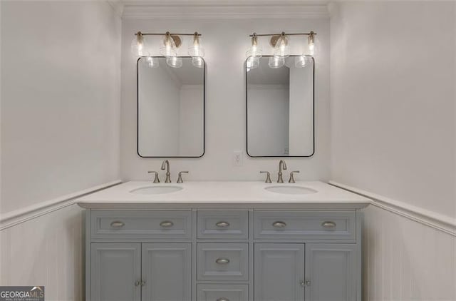 bathroom with vanity and ornamental molding