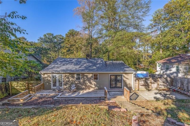 back of house with a patio and french doors