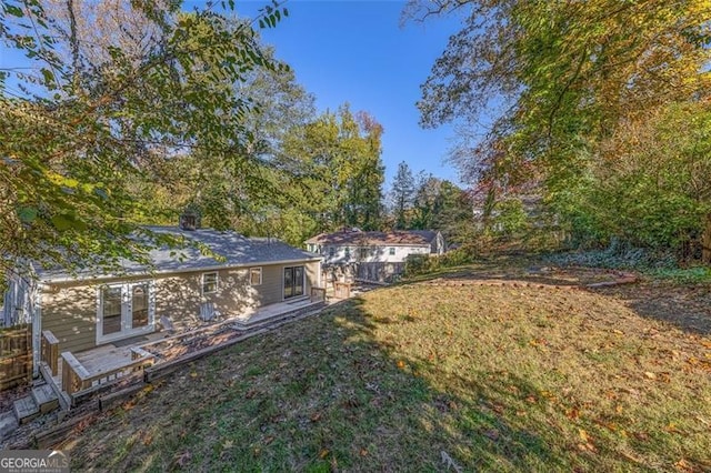 view of yard featuring french doors