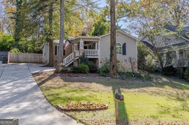 view of front of home with a front lawn and covered porch