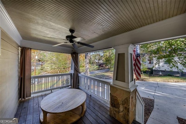 deck featuring ceiling fan and a porch