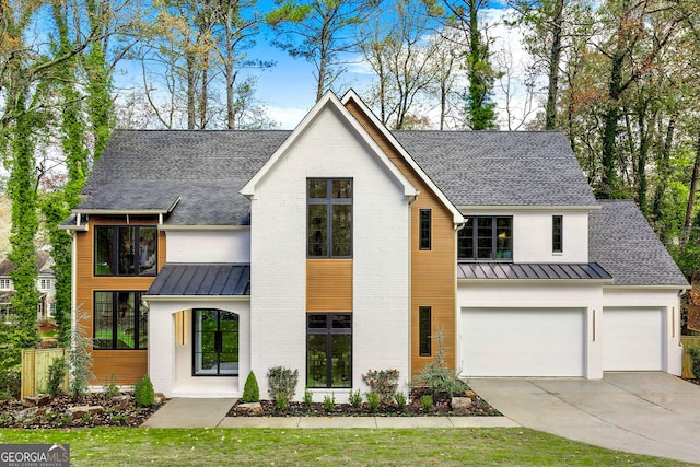 modern inspired farmhouse featuring a garage