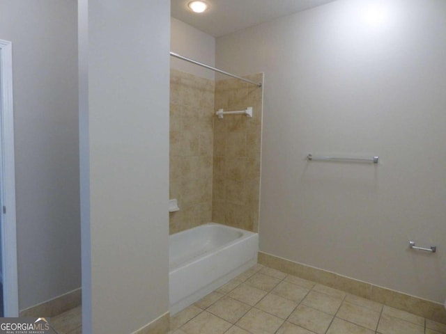 bathroom with tile patterned floors and tiled shower / bath