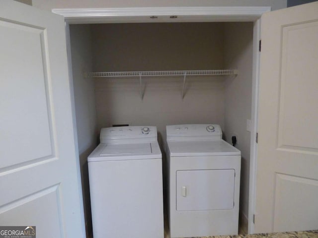 washroom with washer and clothes dryer